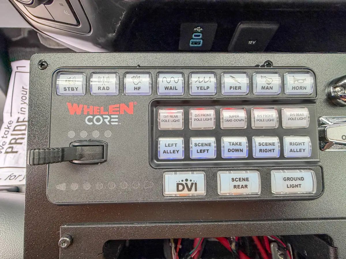 Tight close-up of programmable switch pad on console.